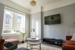 TV a/nebo společenská místnost v ubytování Alexandra House