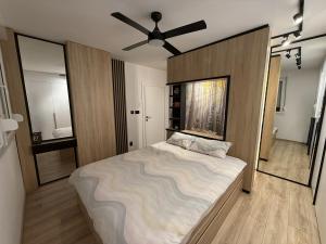 a bedroom with a large bed with a ceiling fan at Central Spot BL in Banja Luka