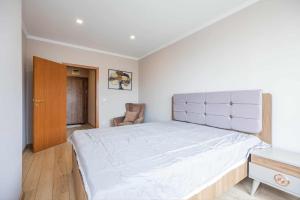 Postel nebo postele na pokoji v ubytování Amphora Palace Apartment Complex + 6 fotografií