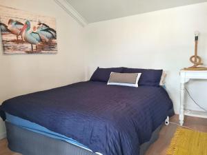 Postel nebo postele na pokoji v ubytování Brooksea at Balgowan