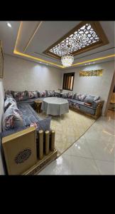 a living room with couches and a table at Residence Ritaj in Agadir