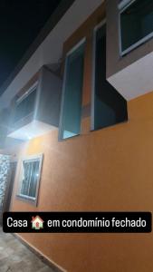 a rendering of a building with windows at Casa de condomínio com piscina e churrasqueira in Sao Paulo