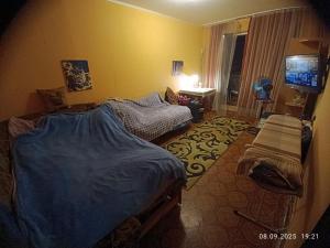 Postel nebo postele na pokoji v ubytování Східний мікрорайон апартаменти