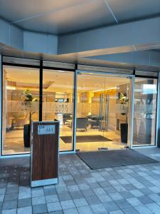 a building with glass windows and a sign in front at Fame Residence Tower 4 near Greenfield and Shaw MRT in Manila +68 photos