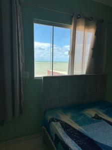 En eller flere senge i et værelse på Casa com vista para farol do Parracho