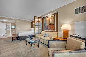 a hotel room with a bed and a living room at Solara Vita at MGM Signature in Las Vegas