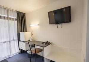 TV a/nebo společenská místnost v ubytování Recreation Hotel