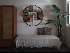 a bedroom with a bed with a mirror on the wall at "la Palma"la casa del sole e del vento in Lingua +42 photos