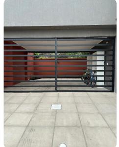 a garage with a bike parked inside of it at Modern apartment in Azul, comfort and style with patio in Azul +1 photo