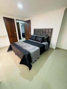 a bedroom with a large bed in a room at Acogedora casa en el carmen de Viboral in Carmen de Viboral +22 photos