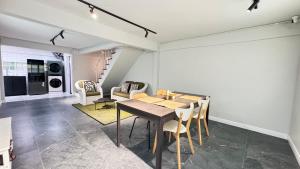 a dining room with a table and chairs at Little Escape in Bangkok