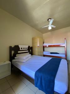 Ένα ή περισσότερα κρεβάτια σε δωμάτιο στο Pousada Nova +51 φωτογραφίες