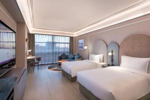 Postel nebo postele na pokoji v ubytování Mercure Beijing Zhongguancun