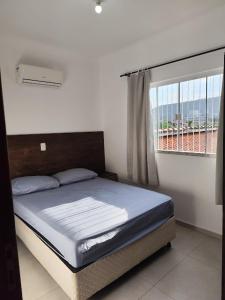 Postel nebo postele na pokoji v ubytování Residencial Ernesto Neves - 5 min da praia de Bombas