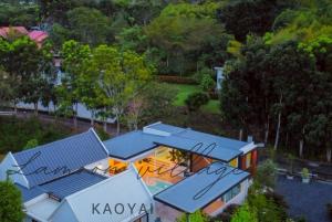 an overhead view of a house with a blue roof at Lamoon Village Khaoyai บ้านละมุน เขาใหญ่ in Pak Chong