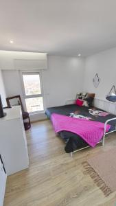 Ένα ή περισσότερα κρεβάτια σε δωμάτιο στο Apartamento Praia