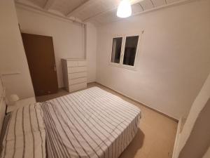 Postel nebo postele na pokoji v ubytování Casa Rural, masia antiga en rehabilitació, Mas Graells + 4 fotografie