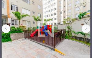 a playground in front of a building at 1706 -Lindo apartamento próximo Tietê e Anhembi in São Paulo