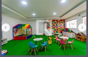 a classroom with tables and chairs and a play room at 1706 -Lindo apartamento próximo Tietê e Anhembi in São Paulo +8 photos