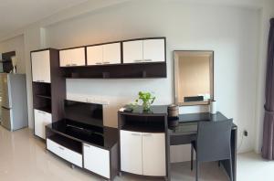 a living room with a desk and a mirror at Aonang Mountain View A5 in Ao Nang Beach
