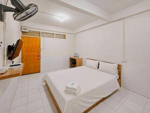 Кровать или кровати в номере Ze Residence Ramintra +10 фотографий