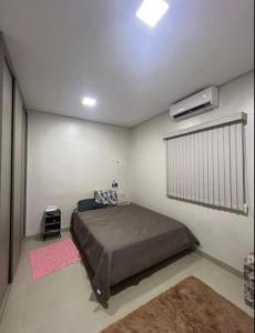 Postel nebo postele na pokoji v ubytování 2 Quartos, sala e 1 banheiro próximos à Universidade Federal de Rondonópolis- UFR