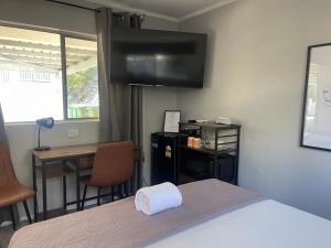 TV a/nebo společenská místnost v ubytování Siesta Villa Motel