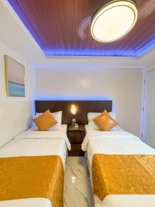 Ένα ή περισσότερα κρεβάτια σε δωμάτιο στο Hotel Adelina Balanga City Bataan