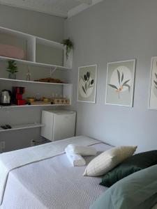 Ένα ή περισσότερα κρεβάτια σε δωμάτιο στο Ótima suíte privada em Torres