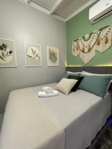 Ένα ή περισσότερα κρεβάτια σε δωμάτιο στο Ótima suíte privada em Torres