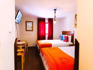 Ένα ή περισσότερα κρεβάτια σε δωμάτιο στο ECOTERRA-SAN FRANCISCO Cusco