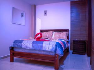 Ένα ή περισσότερα κρεβάτια σε δωμάτιο στο Hospedaje la Cascada