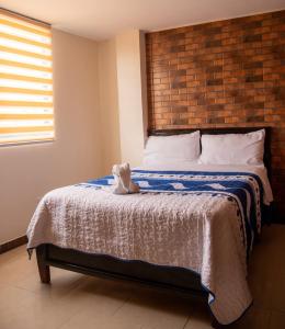 Ένα ή περισσότερα κρεβάτια σε δωμάτιο στο Hospedaje la Cascada