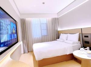 Μια τηλεόραση ή/και κέντρο ψυχαγωγίας στο JI Hotel Shanghai Hailun Road Subway Station