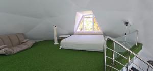 En eller flere senge i et værelse på Dream Villa