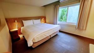 Ένα ή περισσότερα κρεβάτια σε δωμάτιο στο 新光兆豐花蓮旅館