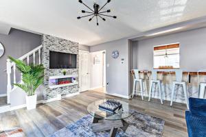 a living room with a couch and a table at BoardGame Bungalow in Atlantic City