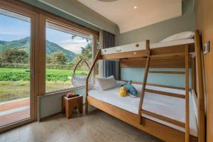 Postel nebo postele na pokoji v ubytování Qiyun·Anji Chashan Yelu Hot Spring Homestay + 78 fotografií