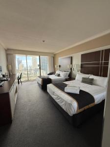 Ένα ή περισσότερα κρεβάτια σε δωμάτιο στο Mantra on View