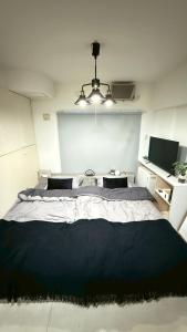 Voodi või voodid majutusasutuse La Parfait de Sapporo 403 Sapporo Station 6-minute walk from Sapporo Station toas +2 fotot