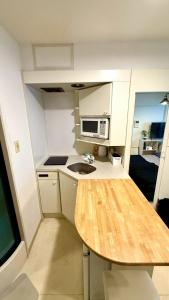 Köök või kööginurk majutusasutuses La Parfait de Sapporo 403 Sapporo Station 6-minute walk from Sapporo Station