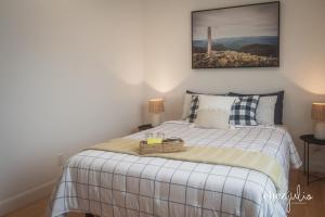 Ένα ή περισσότερα κρεβάτια σε δωμάτιο στο gîte chez julio