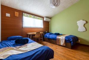 Postel nebo postele na pokoji v ubytování Oceania Ichinomiya - Vacation STAY 27239v