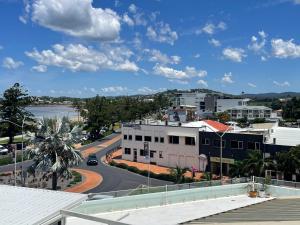 a view of a city with a road and buildings at Heart of Yeppoon - Ocean View Apartment in Yeppoon