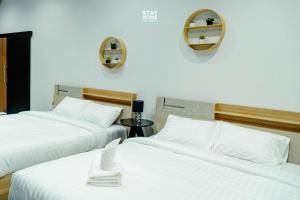 Ένα ή περισσότερα κρεβάτια σε δωμάτιο στο Loft Hatyai l ลอฟท์หาดใหญ่
