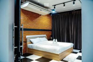 Ένα ή περισσότερα κρεβάτια σε δωμάτιο στο Loft Hatyai l ลอฟท์หาดใหญ่