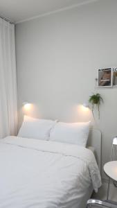 Ένα ή περισσότερα κρεβάτια σε δωμάτιο στο 미니호텔 먹