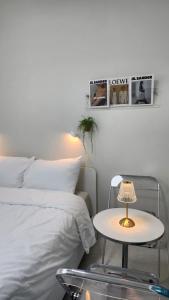 Ένα ή περισσότερα κρεβάτια σε δωμάτιο στο 미니호텔 먹