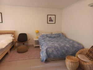 Postel nebo postele na pokoji v ubytování Hongcheon Riverhill Stay