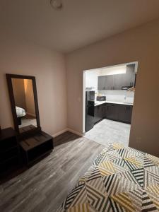an empty room with a bed and a mirror at Studio 6 Humble, TX in Humble